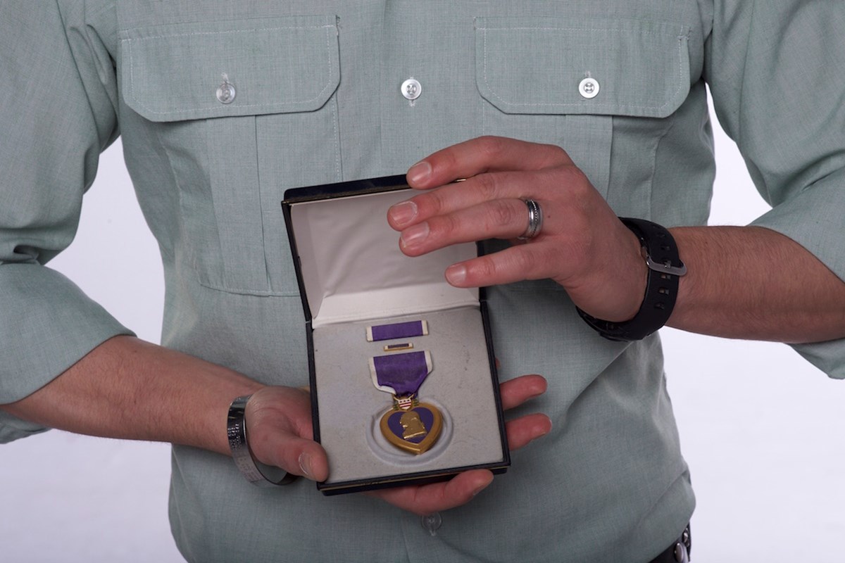Ryan, a U.S. Army Veteran, with his Purple Heart medal